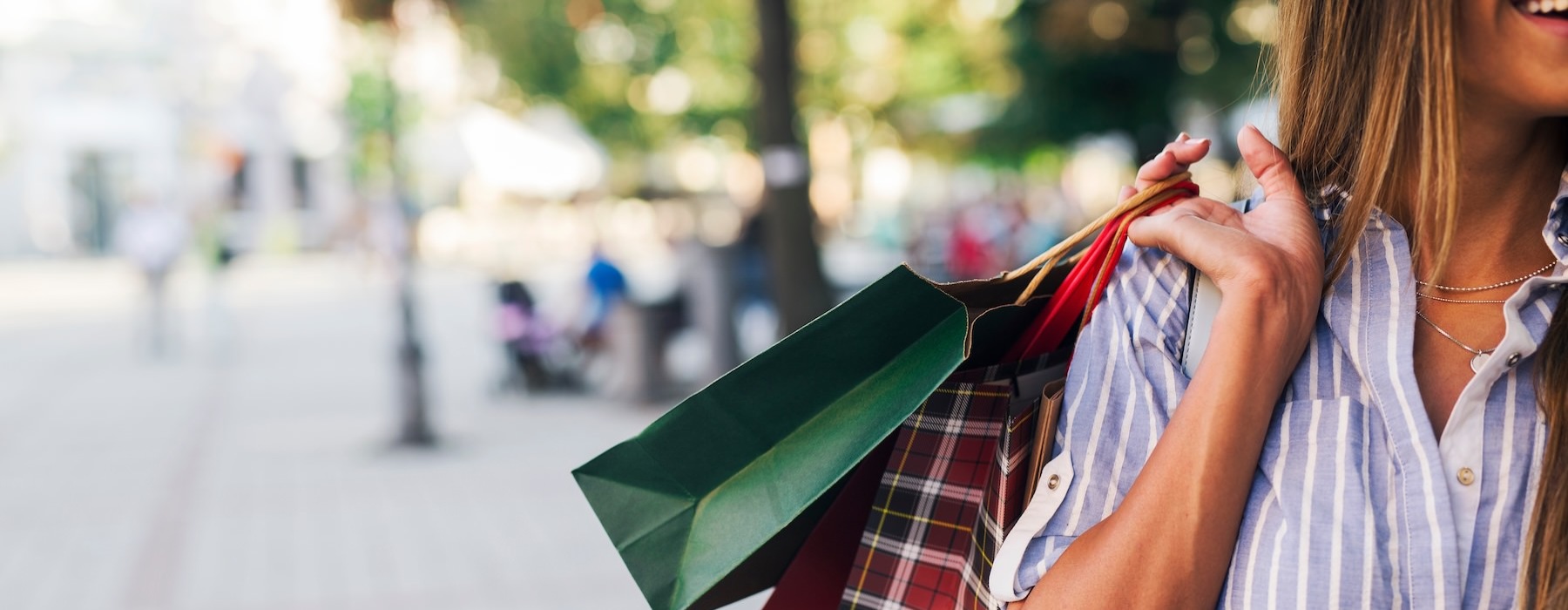 a person holding a shopping bag