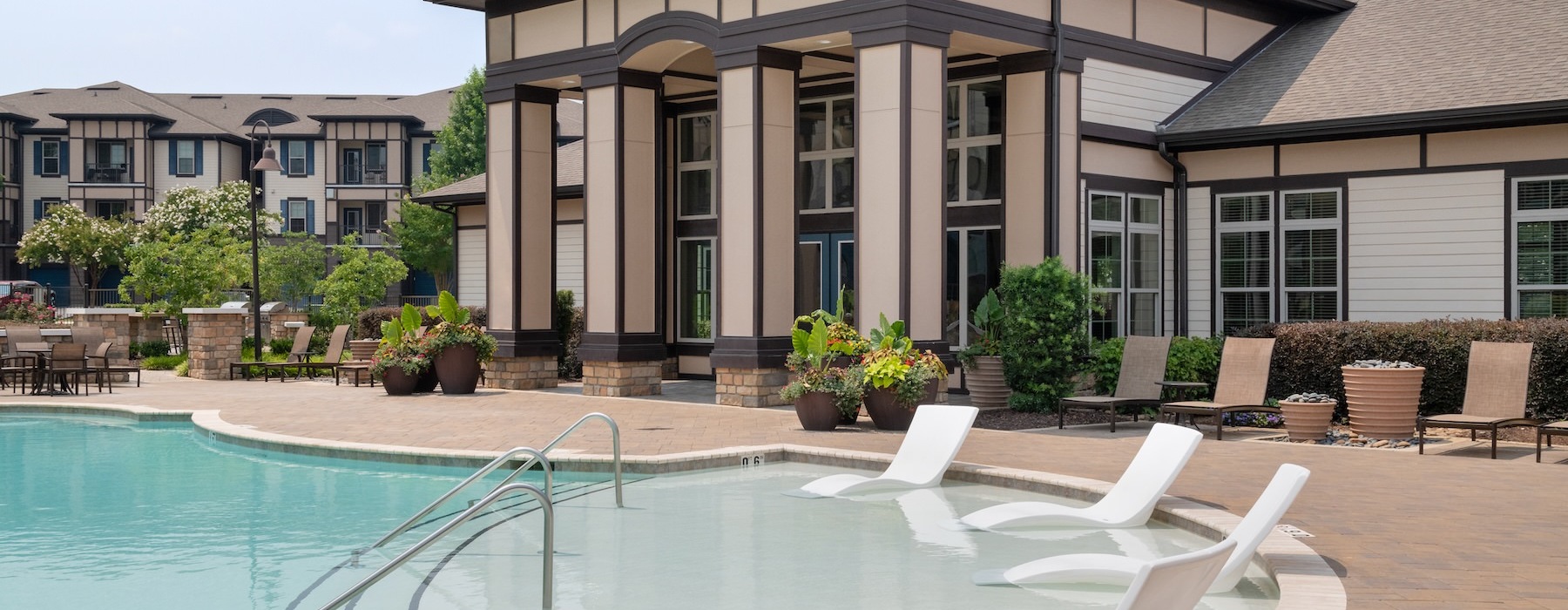 a swimming pool in front of a house