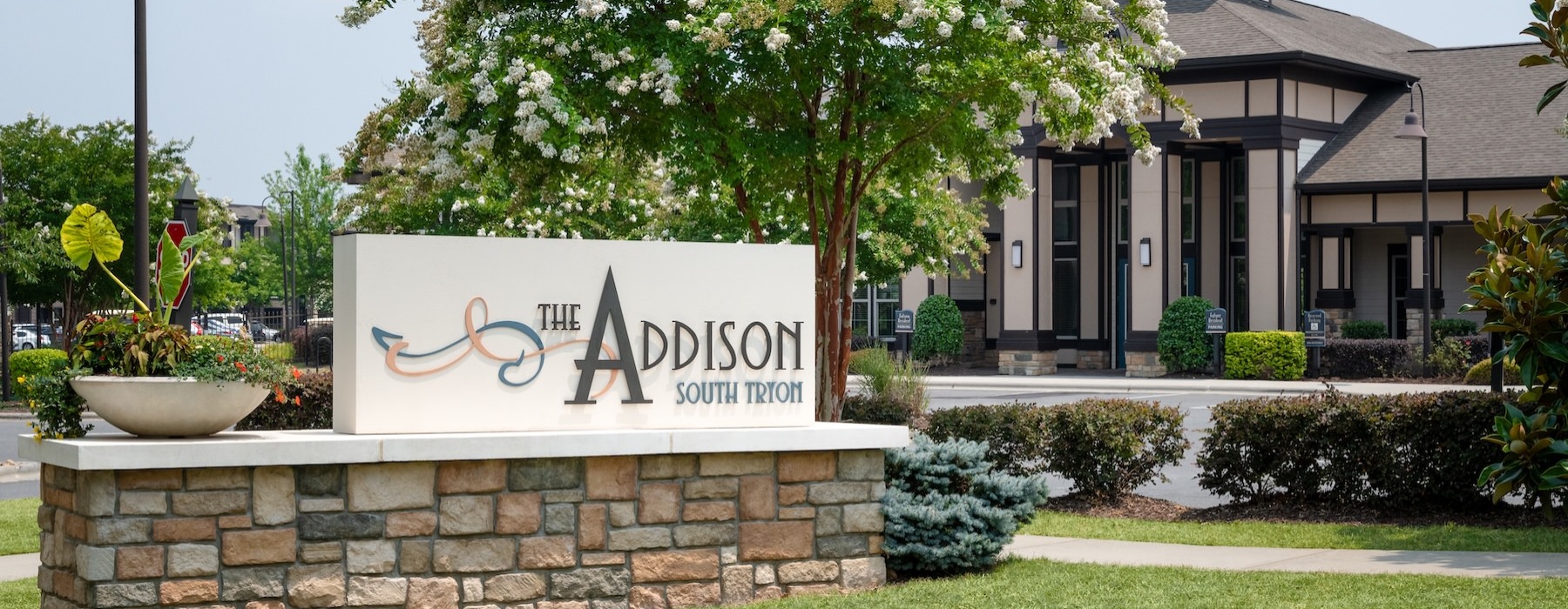 a sign in front of a house